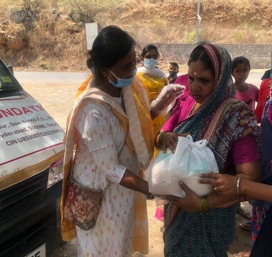 Supplies being handed to a woman.