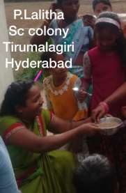 A photograph of P. Lalitha holding a bowl of the nutrition drink, several children and women around.